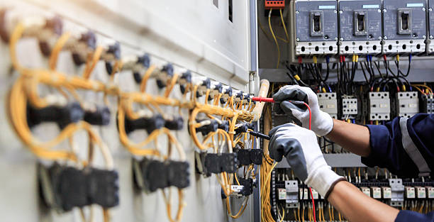 Professional Electrician technician working in Baxter Estates, NY